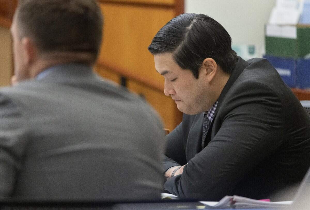 Tacoma Police Officer Timothy Rankine looks down as defense attorney Anne Bremner, attorney for Timothy Rankine, asks questions of Tacoma Police Officer Masyih Ford in Pierce County Superior Court Wednesday Nov. 15, 2023, in Tacoma, WA. Tacoma police officers Christopher Burbank, Matthew Collins and Timothy Rankine are charged with the death of Manny Ellis. Ford was RankineÕs partner at the time of his killing. At left is defense attorney Casey Arbenz. (Ellen M. Banner / Pool / The Seattle Times)