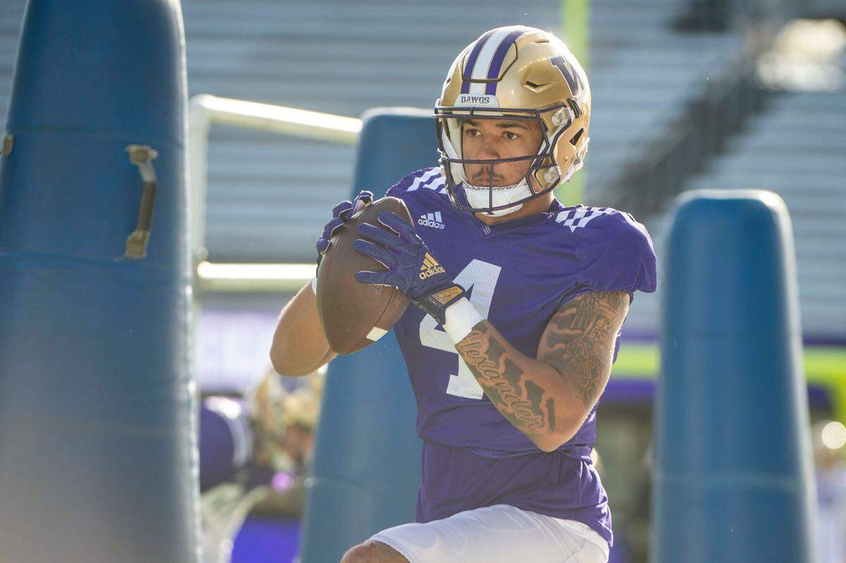 Washington receiver Lonyatta Alexander, Jr. catches a pass during a drill at spring practice on Friday, April 8, 2022, at Husky Stadium in Seattle.