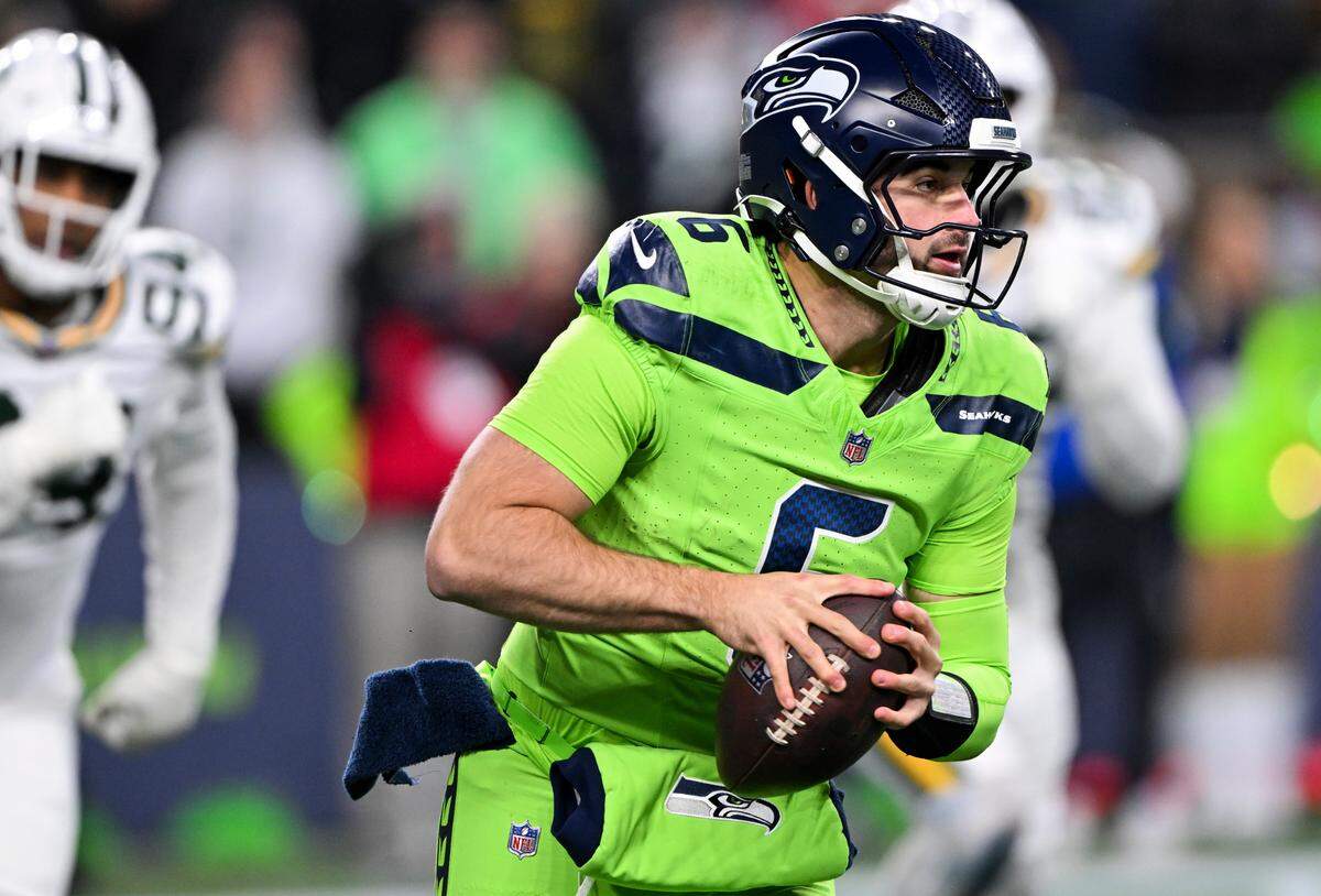 Seattle Seahawks quarterback Sam Howell (6) scrambles under pressure during the third quarter of the game against the Seattle Seahawks at Lumen Field, on Sunday, Dec. 15, 2024, in Seattle, Wash.