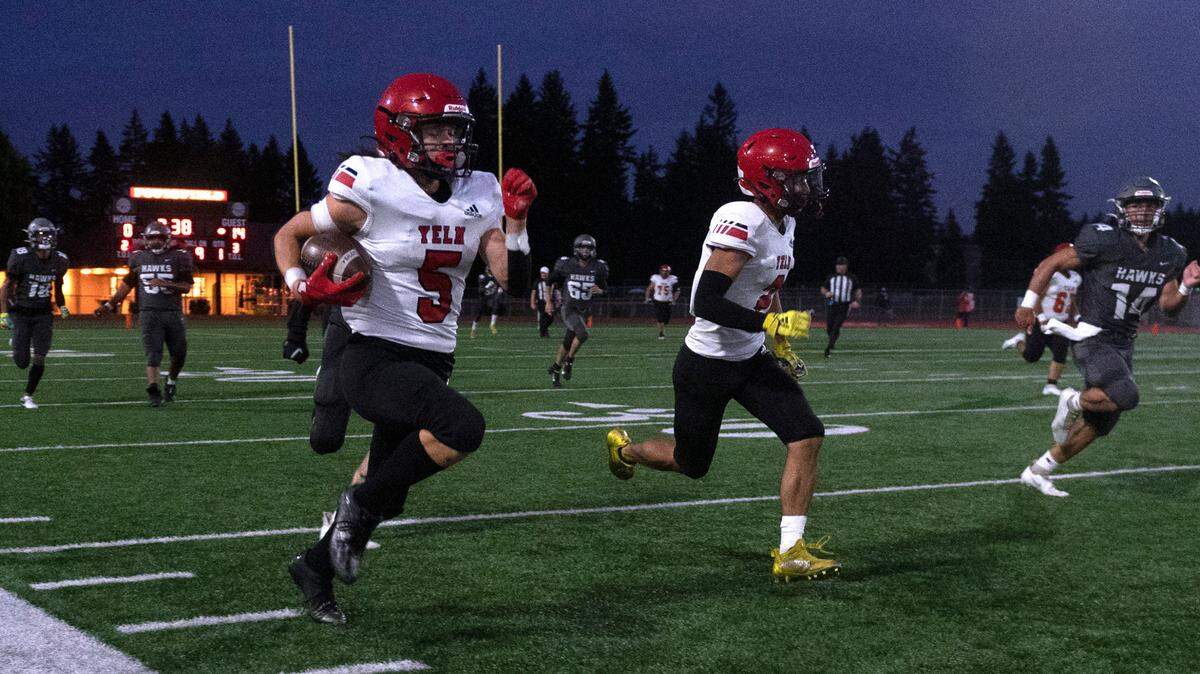 Yelm wide receiver Kyler Ronquillo breaks loose for a long run during Friday night’s high school football game against the River Ridge Hawks at South Sound Stadium in Lacey, Washington, on Sept. 24, 2021.