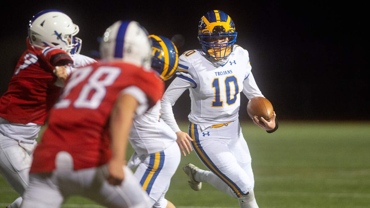Fife quarterback Brynna Nixon turns the corner on the Washington defense during Friday night’s football game at Frankin Pierce High School in Tacoma, Washington, on Friday, March 5, 2021.