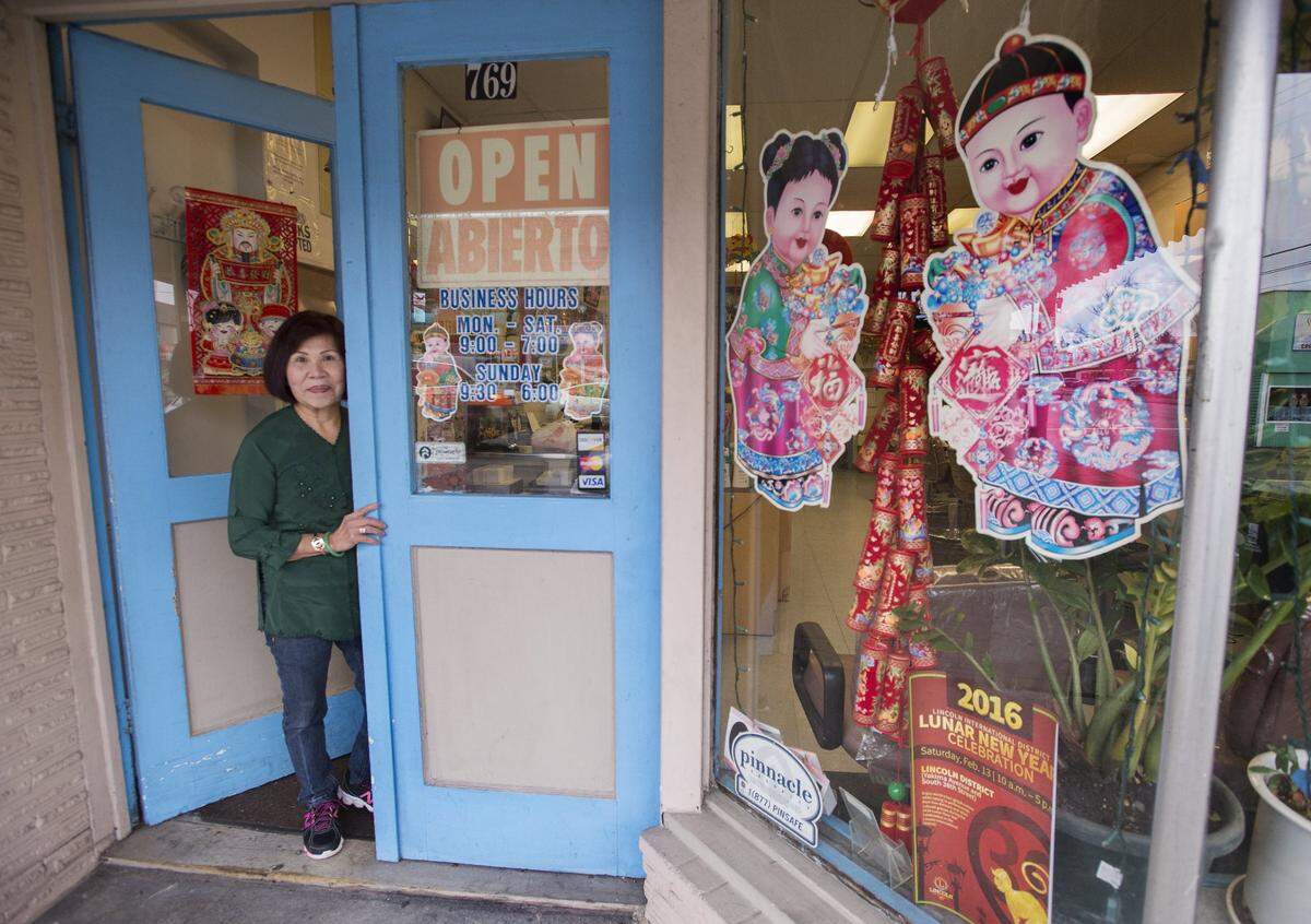 Lam in the doorway of her Tacoma salon in February 2016. She and Mathusz are looking for the next generation of Lunar New Year organizers.