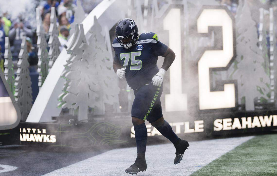 Seattle Seahawks guard Anthony Bradford (75) runs out before the game against the Indianapolis Colts at Lumen Field, on Sunday, Dec. 14, 2025, in Seattle.