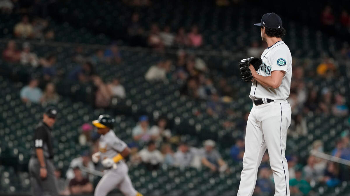 Seattle Mariners pitcher Daniel Zamora, right, watches as Oakland Athletics’ Tony Kemp runs the bases after hitting a two-run home run during the eighth inning of a baseball game Tuesday, June 1, 2021, in Seattle. (AP Photo/Ted S. Warren)