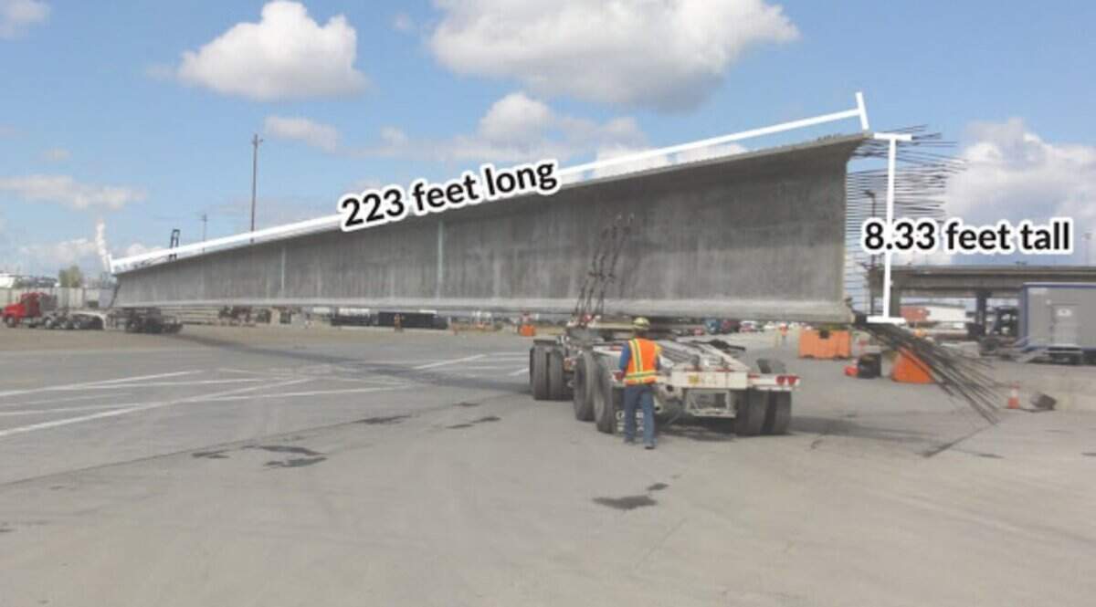 A Washington State Department of Transportation photo shows a record-setting giant girder at 223 feet and weighing more than 246,500 pounds, roughly the weight of a blue whale and length of a 747 plane.