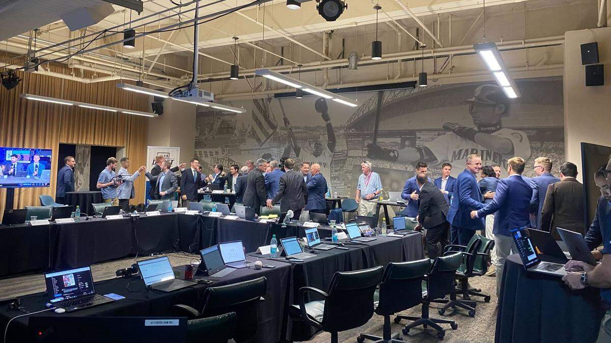 The Seattle Mariners front office celebrates with smiles, hugs, and handshakes after selecting Mississippi State switch-pitcher Jurrangelo Cijntje with the 15th overall pick in the 2024 MLB Draft in Seattle on July 14, 2024.