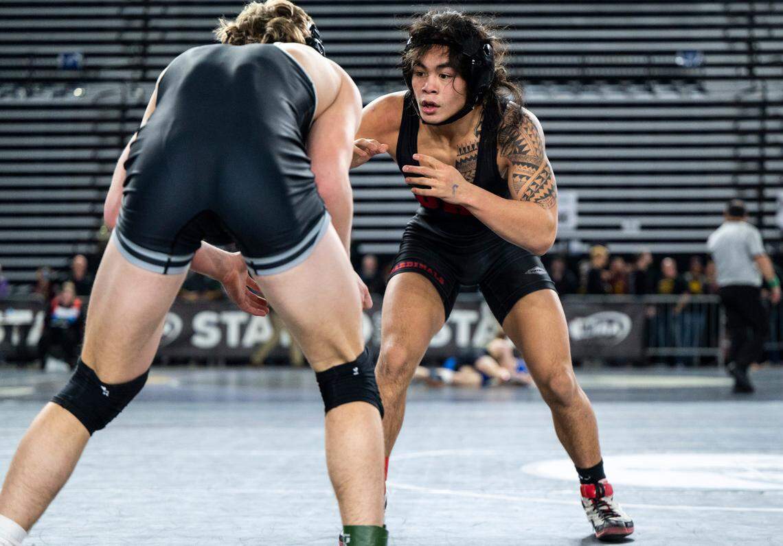 Orting Apollo Cruz wrestles Othello Forrest Roylance during the 138-pound 2A quarterfinal match at Mat Classic XXXIV on Friday, Feb. 17, 2023, at the Tacoma Dome in Tacoma, Wash. Cruz defeated Roylance 16-3.