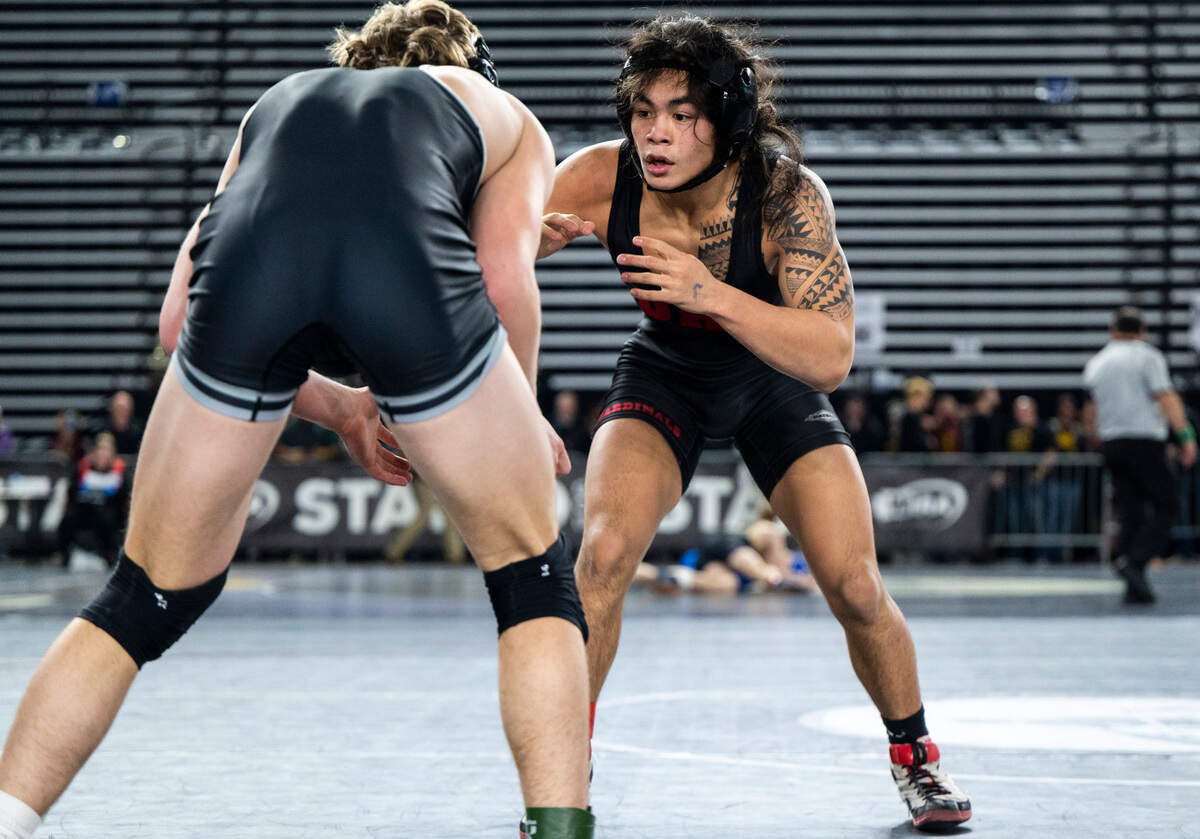 Orting Apollo Cruz wrestles Othello Forrest Roylance during the 138-pound 2A quarterfinal match at Mat Classic XXXIV on Friday, Feb. 17, 2023, at the Tacoma Dome in Tacoma, Wash. Cruz defeated Roylance 16-3.