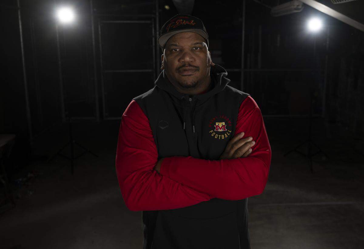 Mount Tahoma defensive coordinator Dion Alexander poses for a portrait after being selected as first-team defensive coordinator for The News Tribune’s 2025 All-Area football team at Mount Tahoma High School, on Sunday, Dec. 7, 2025, in Tacoma, Wash.