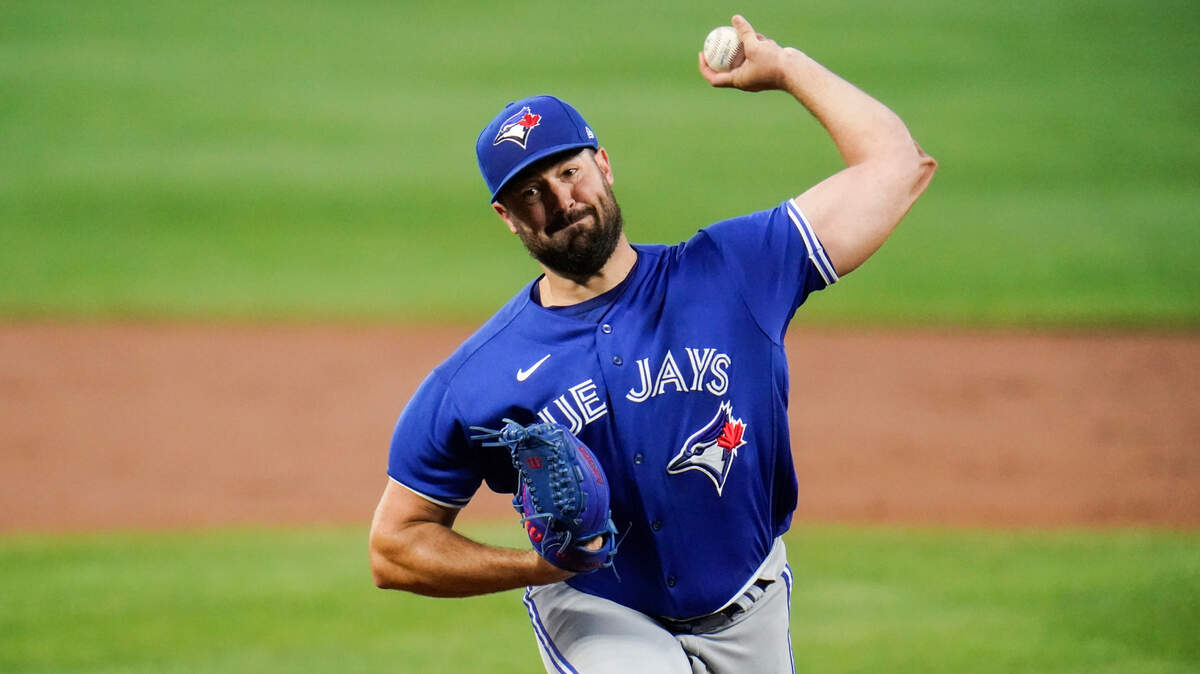 Toronto Blue Jays starting pitcher Robbie Ray throws a pitch to the Baltimore Orioles during the first inning of a baseball game, Friday, Sept. 10, 2021, in Baltimore. (AP Photo/Julio Cortez)