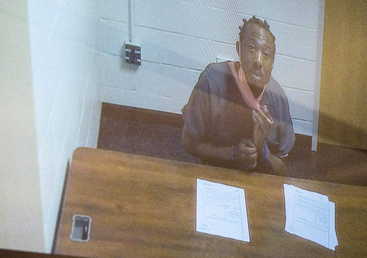 Jerrmell Warren appears remotely in court for his arraignment following him being charged Friday in the May 26 fatal shooting of Angelina Lee, at the County City Building in Tacoma, Wash. on Friday, June 10, 2022.