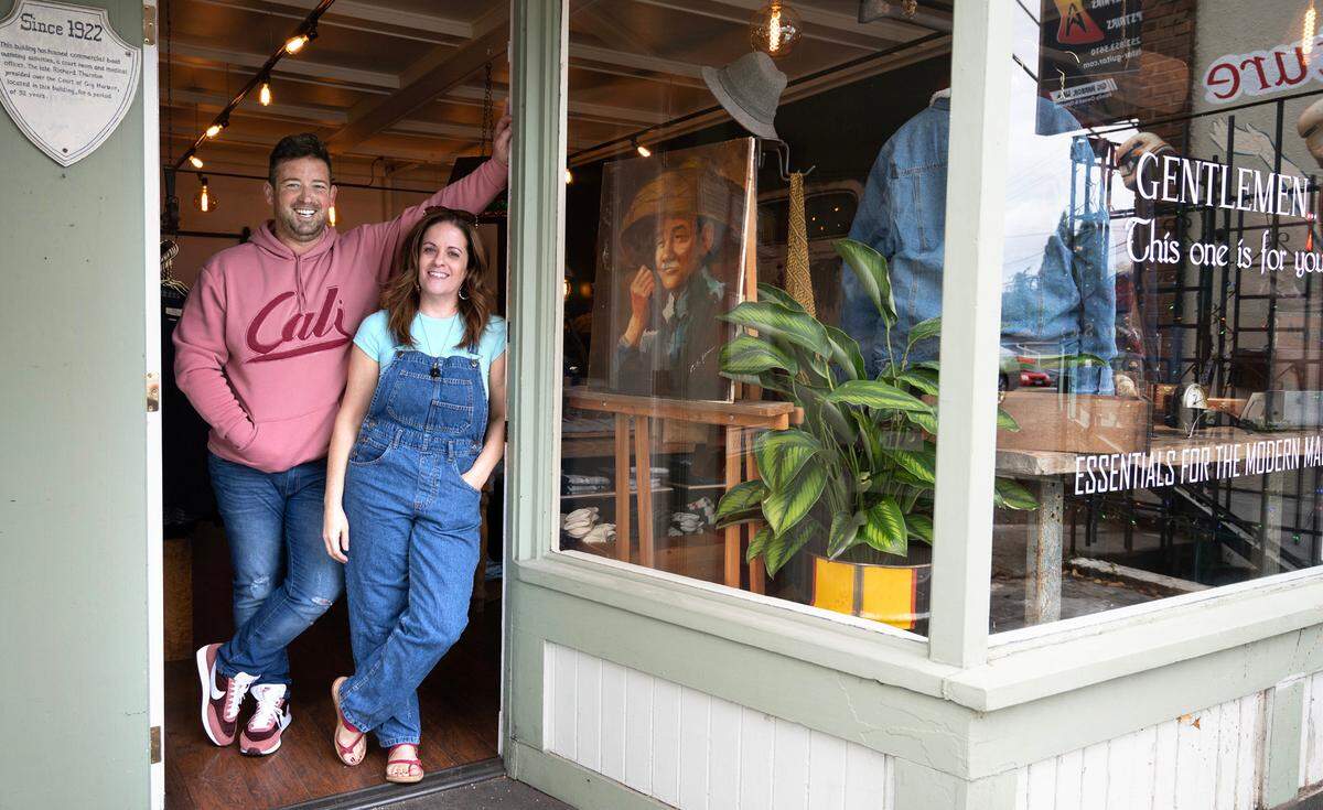 Bruce Hillenbach and Starr Hall pose for a photo at their newest store, the One:11 men’s store, in downtown Gig Harbor, Sept. 20, 2023.