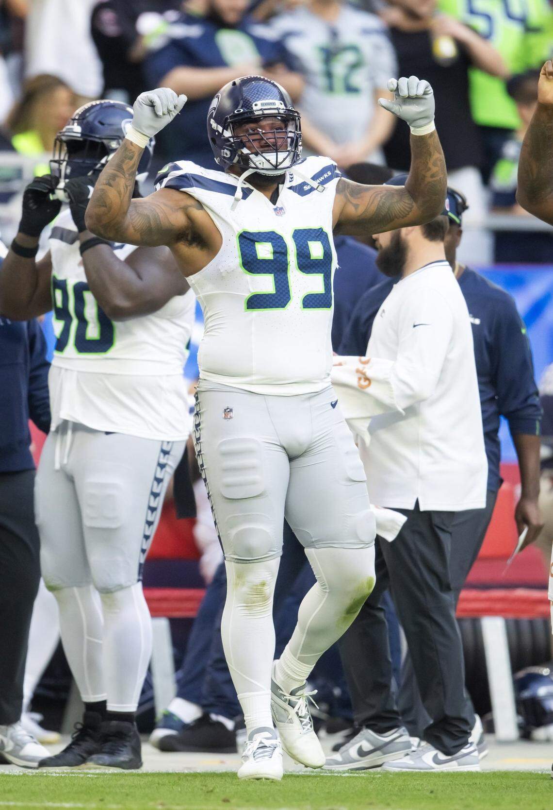 Seattle Seahawks defensive end Leonard Williams (99) celebrates against the Arizona Cardinals in the first half at State Farm Stadium. Mandatory Credit: Mark J. Rebilas-Imagn Images