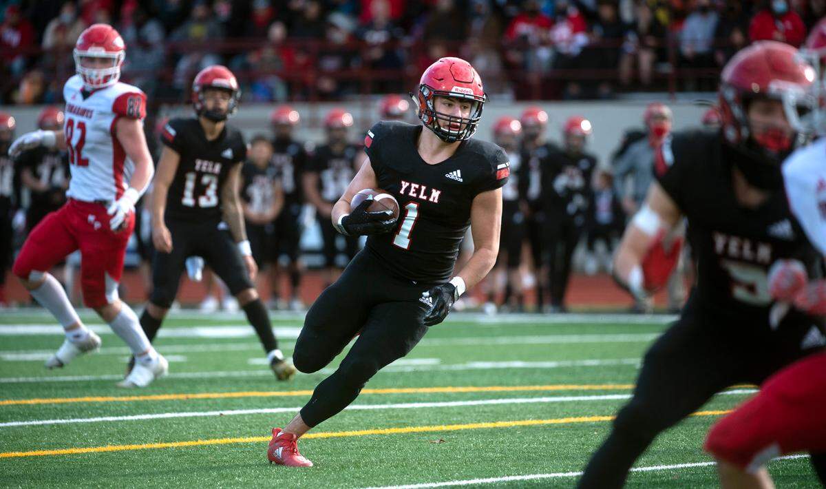 Yelm running back Ray Wright heads for the end zone after pulling in a pass from quarterback Palaina Hooper to open scoring in Saturday afternoon’s 3A football state quarterfinal game at Yelm High School in Yelm, Washington, on Nov. 20, 2021. Marysville-Pilchuck won the game, 39-21.