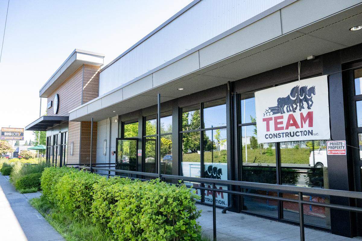 Construction banners hang from the former MOD Pizza location at the Westgate South shopping center as work takes place on the interior on Wednesday, May 28, 2025, in Tacoma.