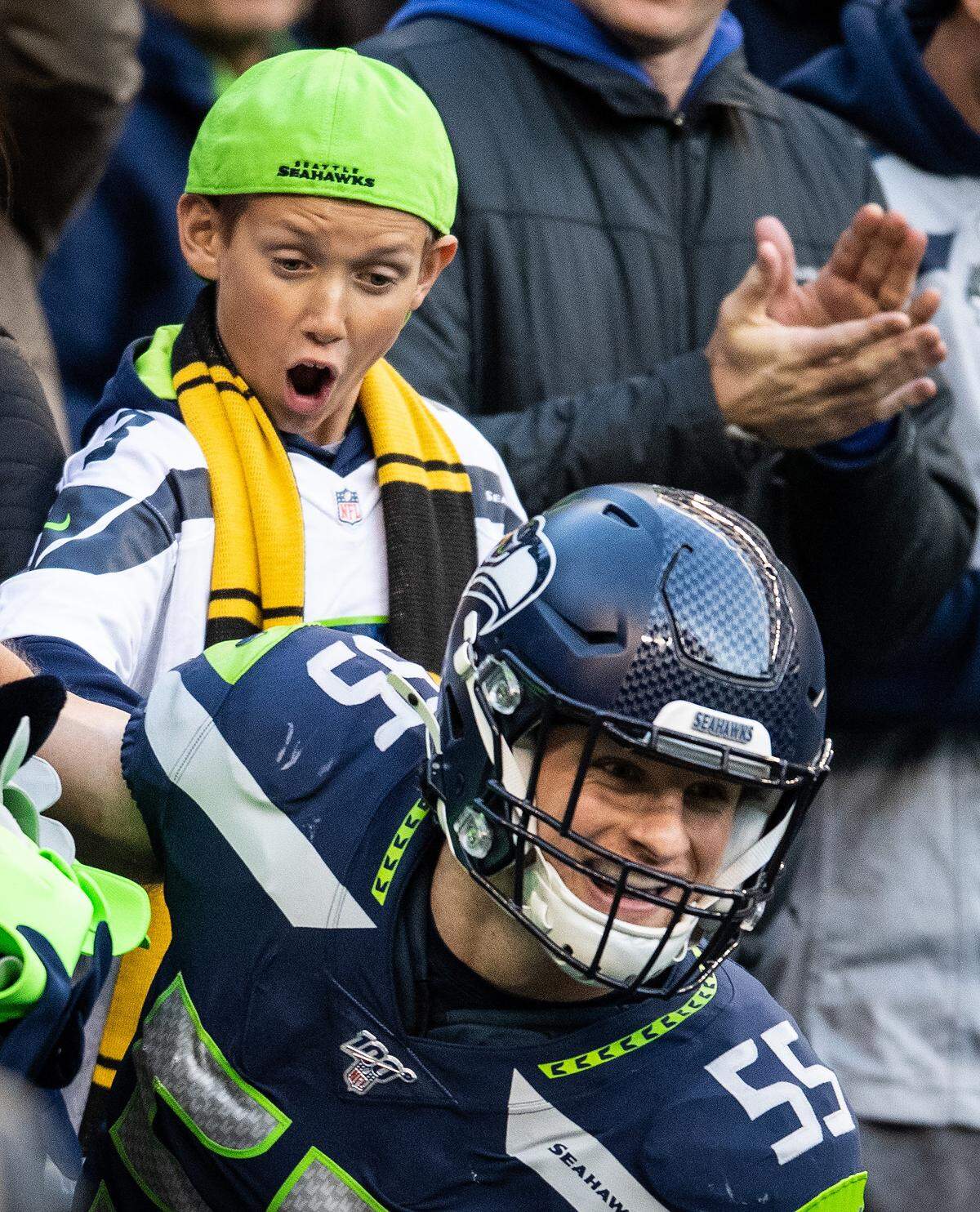 A young fan is amazed as Seattle Seahawks linebacker Ben Burr-Kirven (55) tackles blitz during the fourth quarter. The Seattle Seahawks played the Tampa Bay Buccaneers in a NFL football game at CenturyLink Field in Seattle, Wash., on Sunday, Nov. 3, 2019.