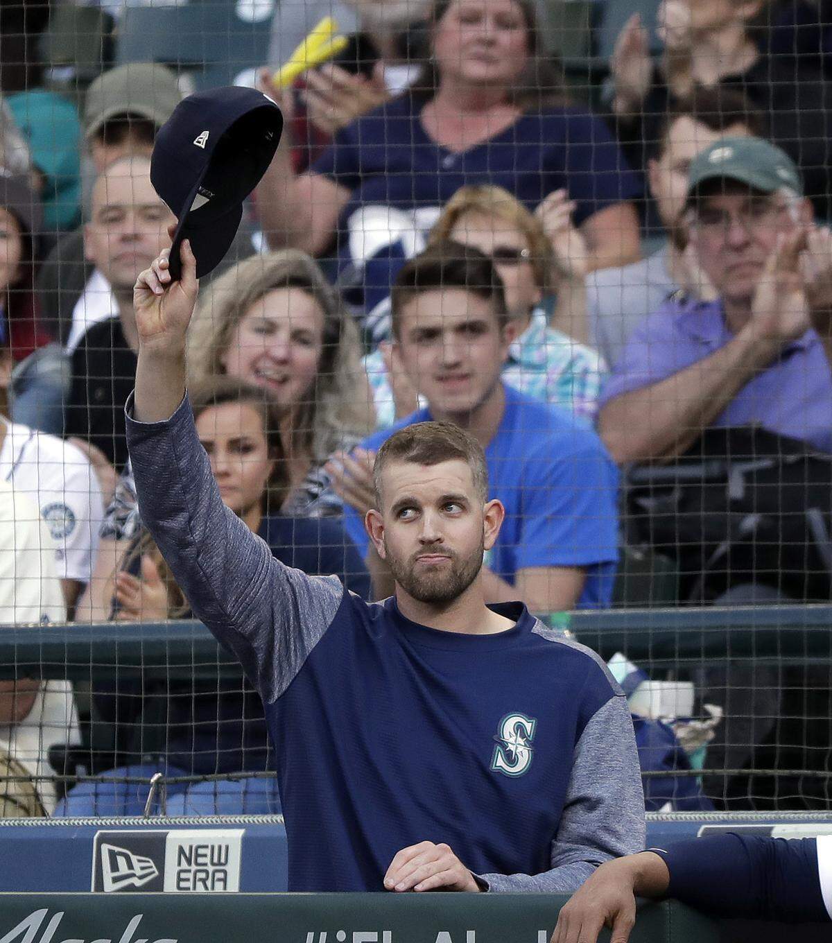 Seattle Mariners pitcher James Paxton waves to fans after being recognized for throwing a no-hitter day earlier, before a baseball game against the Texas Rangers Tuesday, May 15, 2018, in Seattle. (AP Photo/Elaine Thompson)