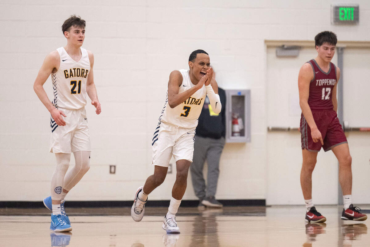 Annie Wright forward Martin Kaupanger (21) and guard Jeremiah Harshman (3) celebrate as Toppenish’s walks off the court after a timeout was called in the third quarter of a Class 1A state regionals game on Saturday, Feb. 25, 2023, at Tacoma Community College, in Tacoma, Wash.