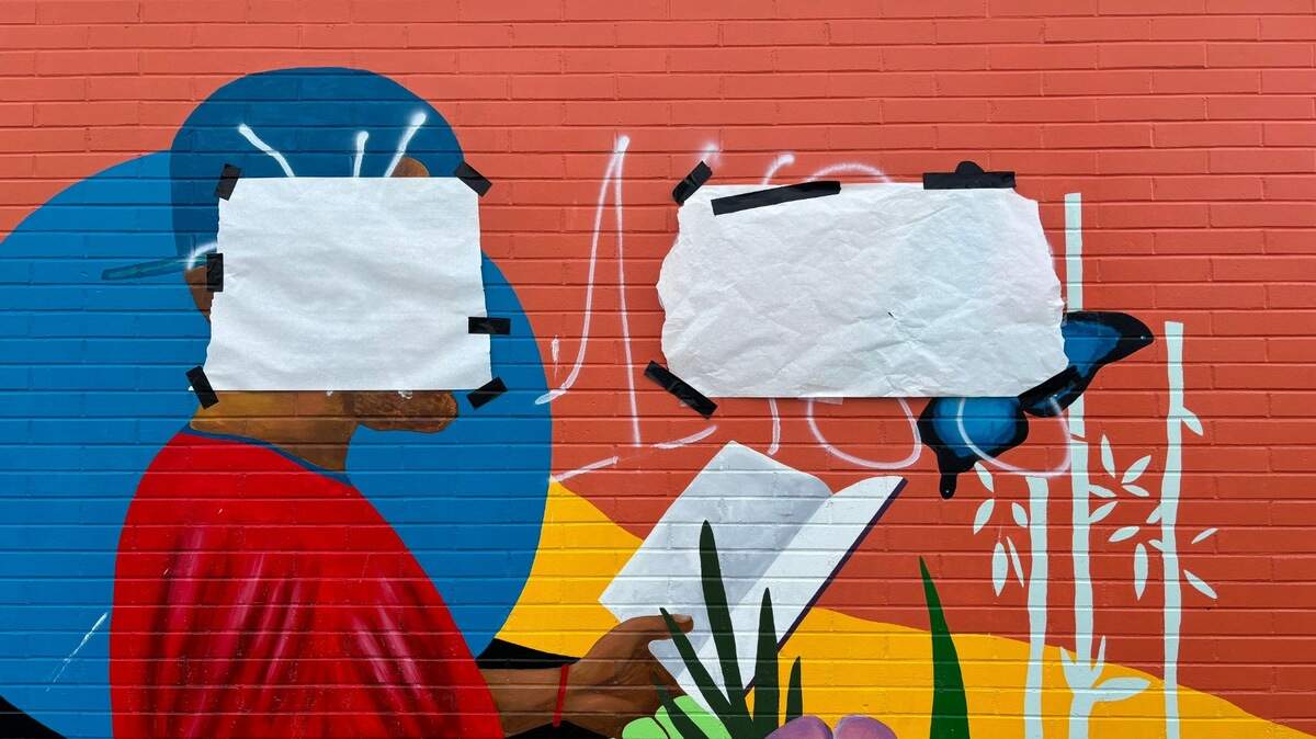 A mural painted outside the South Branch of the Tacoma Public Library was defaced with racist slurs and white-supremacist imagery.