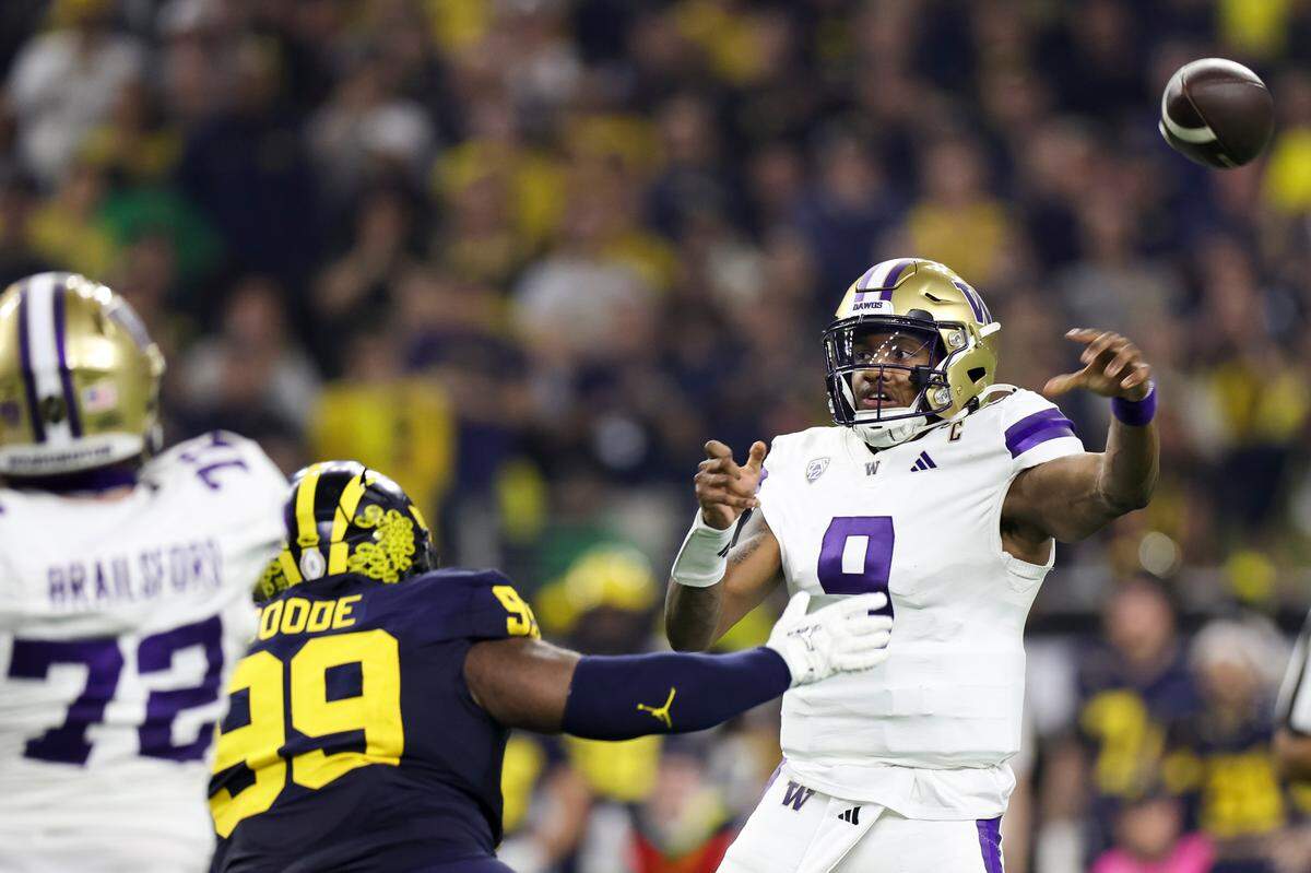 Washington Huskies quarterback Michael Penix Jr. (9) throws the ball during the second quarter of the College Football Playoff National Championship game against the Michigan Wolverines at NRG Stadium on Monday, Jan. 8, 2024, in Houston.