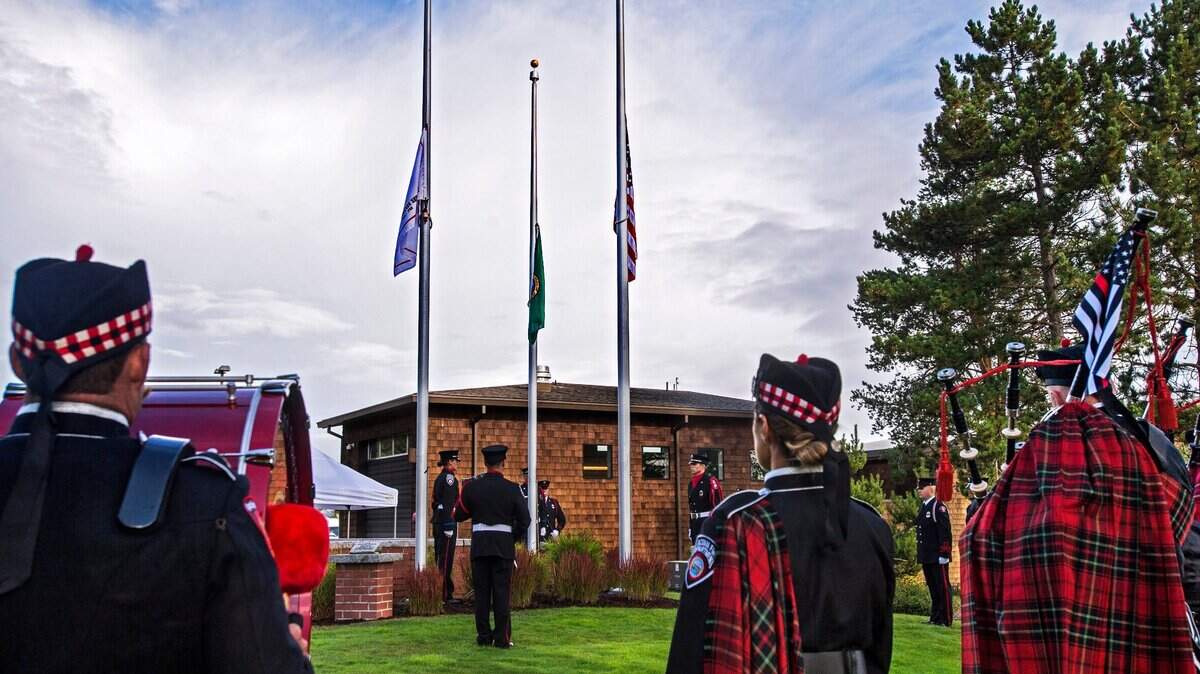 Flags are lowered to half staff during a ceremony Tuesday in remembrance of the sacrifice made by first responders during the 9/11 terrorist attacks in 2001. The event was led by the Tacoma Fire Department Honor Guard at the fallen firefighters memorial on Ruston Way.