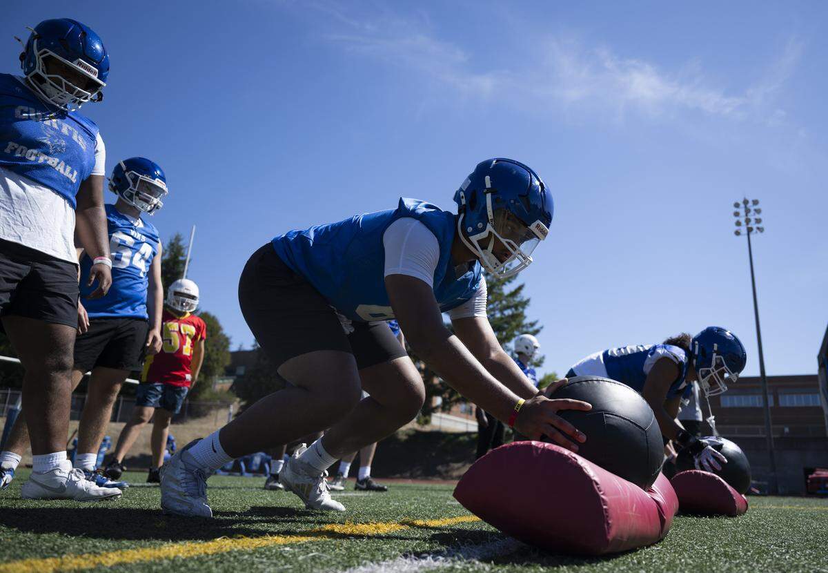 Curtis offensive lineman Kingston Kerkhoff runs a drill during a football practice at Curtis Senior High school on Thursday, Aug. 21, 2025, in University Place, Wash.