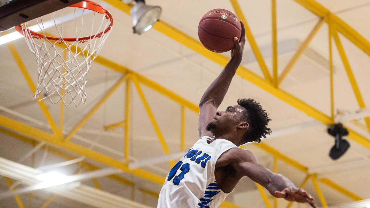 Federal Way’s Tari Eason (13) throws down a dunk in the second quarter. Kentridge played Federal Way in a basketball game at Enumclaw High School in Enumclaw, Wash., on Saturday, Feb. 2, 2019.