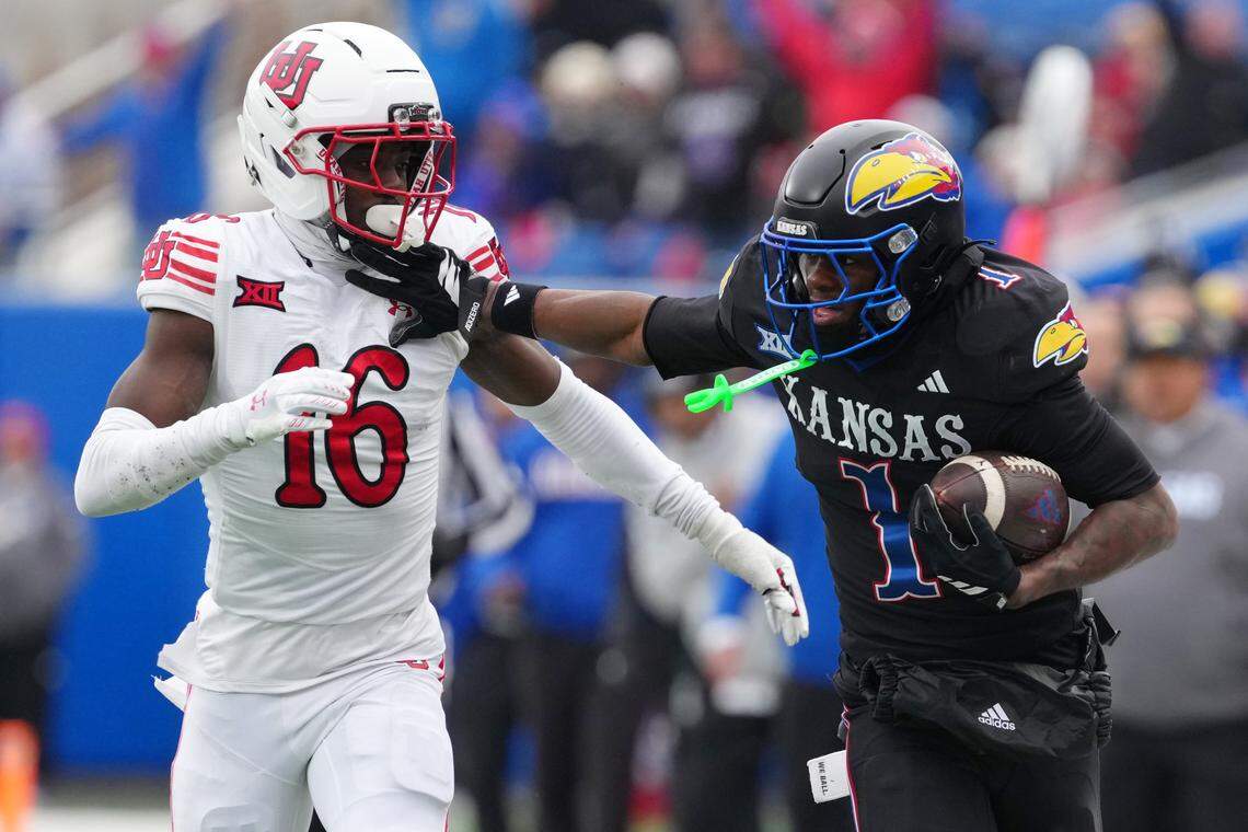 LAWRENCE, KANSAS - NOVEMBER 28: Wide receiver Emmanuel Henderson Jr. #1 of the Kansas Jayhawks catches a pass against cornerback Blake Cotton #16 of the Utah Utes in the second half at David Booth Kansas Memorial Stadium on November 28, 2025 in Lawrence, Kansas. (Photo by Ed Zurga/Getty Images)