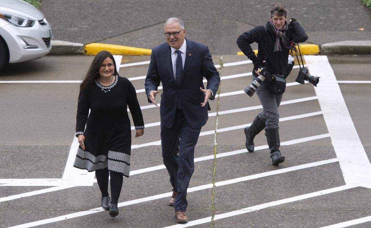 Gov. Jay Inslee escorts Whatcom County Superior Court Judge Raquel Montoya-Lewis to the Temple of Justice in Olympia, where he announced her appointment to the Washington State Supreme Court on Dec. 4.