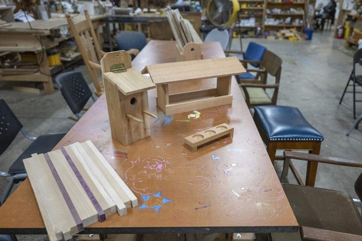 A collection of projects made by youth in the Tacoma Boat Builders program sit on a table in the organization's workshop on Friday, April 24, 2026, in Tacoma, Wash.