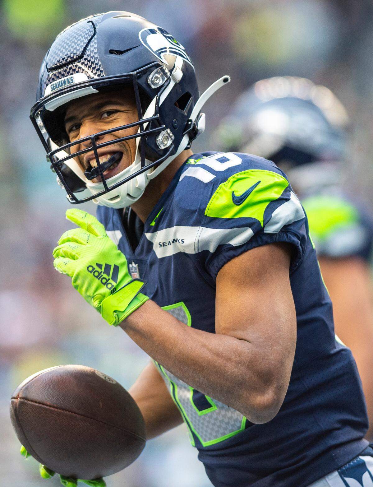 Seattle Seahawks wide receiver Tyler Lockett (16) celebrates scoring a touchdown in the second quarter of an NFL game against the Carolina Panthers at Lumen Field in Seattle Wash., on Dec. 11, 2022. The Seahawks lost to the Panthers 24-30.