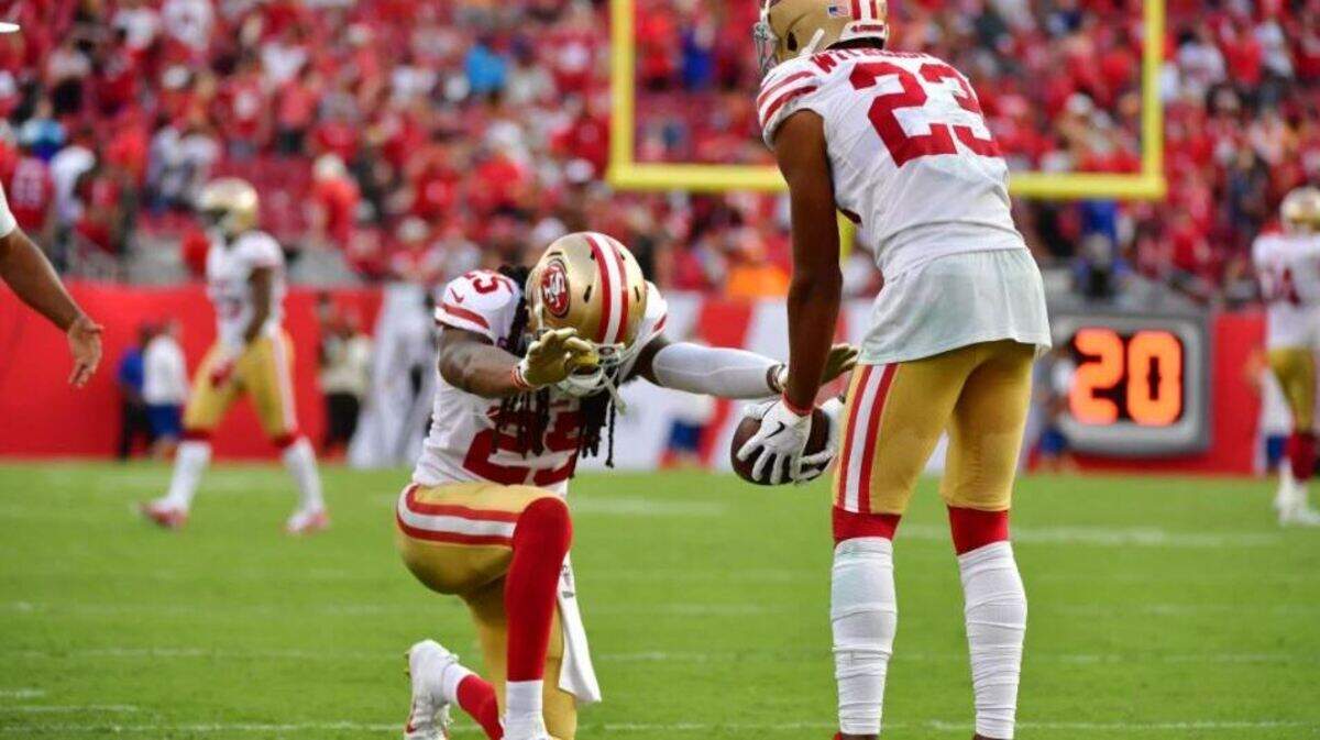 Richard Sherman (25) bows in praise of Ahkello Witherspoon (23) after Witherspoon returned his interception of Tampa Bay’s Jameis Winston for a touchdown for the San Fransico 49ers on Sept. 8, 2019, at Raymond James Stadium in Tampa, Florida.