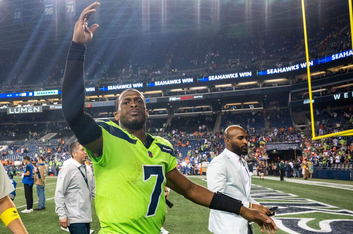 Seahawks quarterback Geno Smith (7) responds to the crowds chants of “Geno, Geno, Geno” as he walks off the field after Seattle beat Denver, 17-16, in an NFL game on Monday, Sept. 12, 2022, at Lumen Field in Seattle.