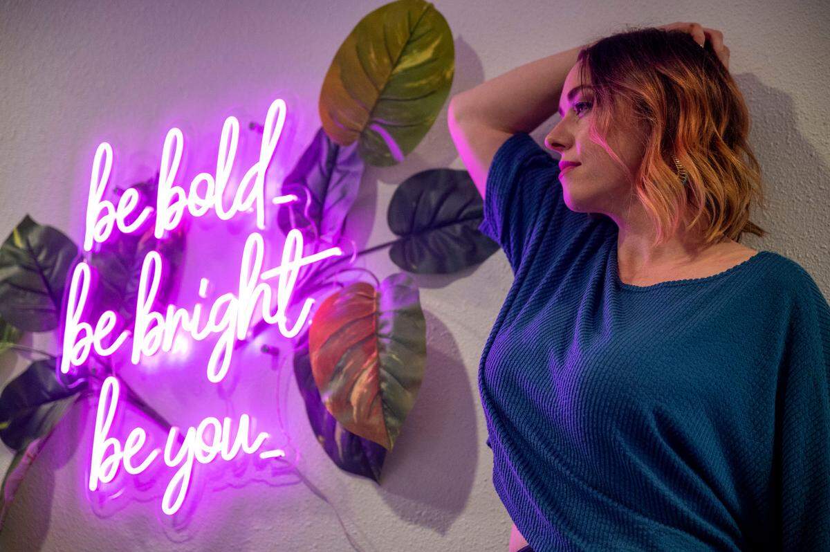 Jody Akerman poses for a portrait inside her studio in downtown Puyallup on Thursday, Oct. 20, 2022. Akerman is a boudoir photographer and owns Bright Eyes Photography.