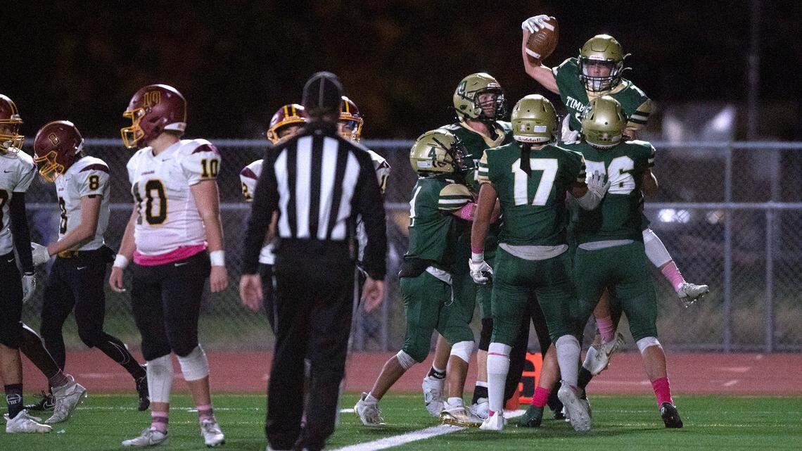 Timberline wide receiver Colby Callahan celebrates his 23-yard touchdown reception with his Blazer teammates during Friday night’s 3A SSC football game against the Capital Cougars at South Sound Stadium in Lacey, Washington, on Oct. 8, 2021.