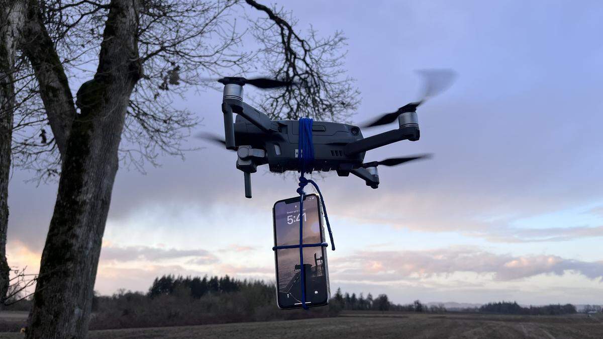 A driver stuck in snow attached his phone to send a text for help in the Willamette National Forest, deputies said. Authorities said the drone pictured is a reenactment.