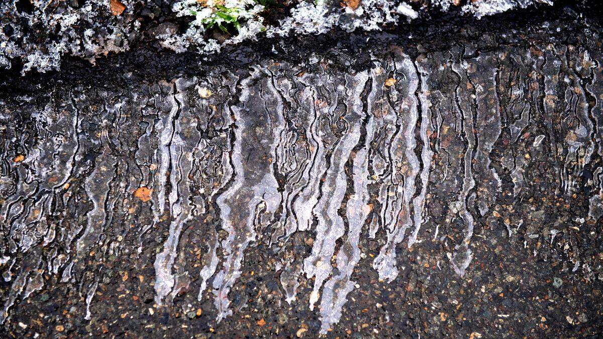 Ice lines the roadway on the the Center Drive off-ramp in DuPont, Washington, on Tuesday, Jan. 4, 2022.