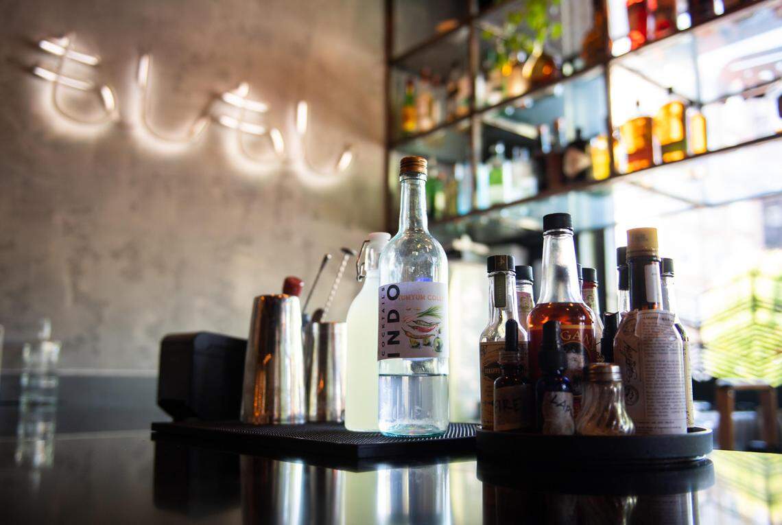 A jalapeo margarita, center left, and a TumYum Collins, center, are two to-go cocktails now being offered at Moshi Moshi in Tacoma, Wash., on Thursday, May 7, 2020. Washington state will allow restaurants with liquor licenses to serve cocktails to-go while restrictions on in-house dining continue.