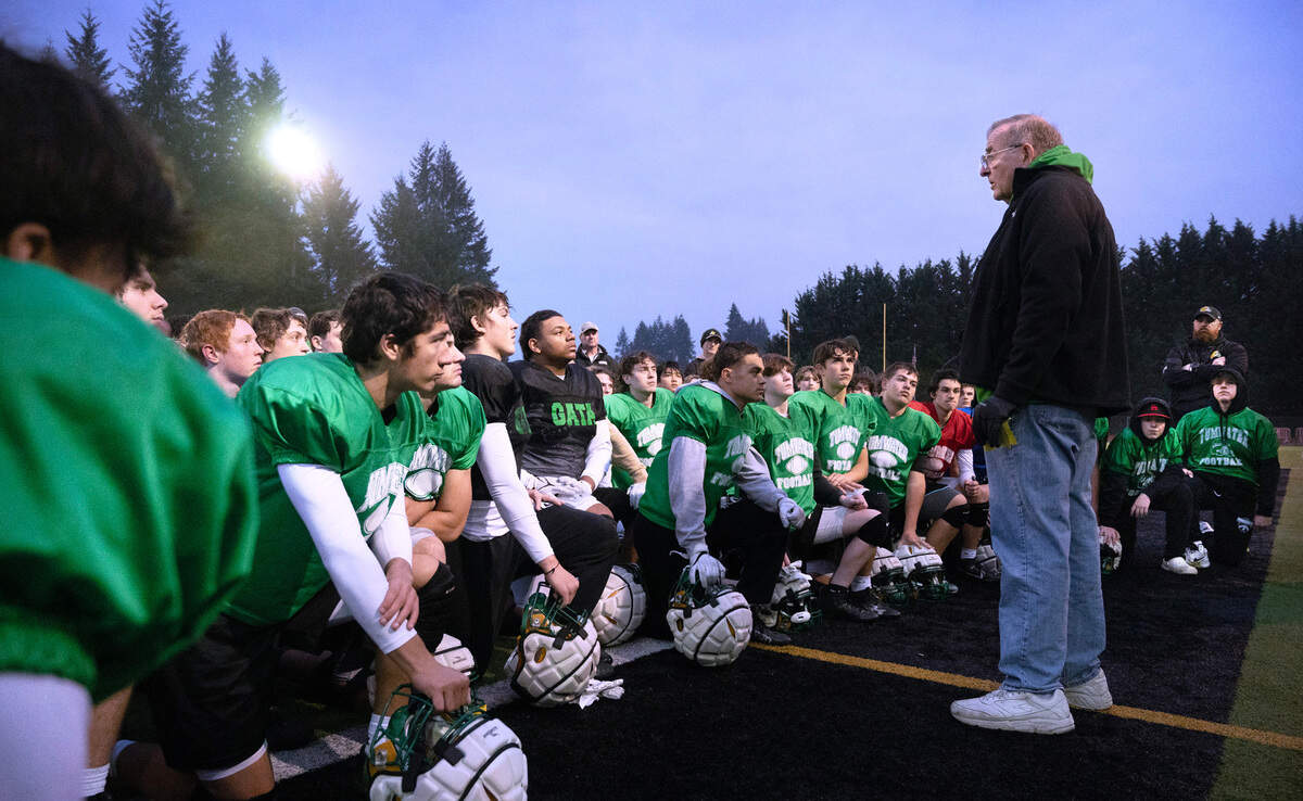 Former Tumwater head football coach Sid Otton addresses the T-Birds following practice at Tumwater District Stadium in Tumwater, Washington, on Wednesday, Nov. 29, 2023.