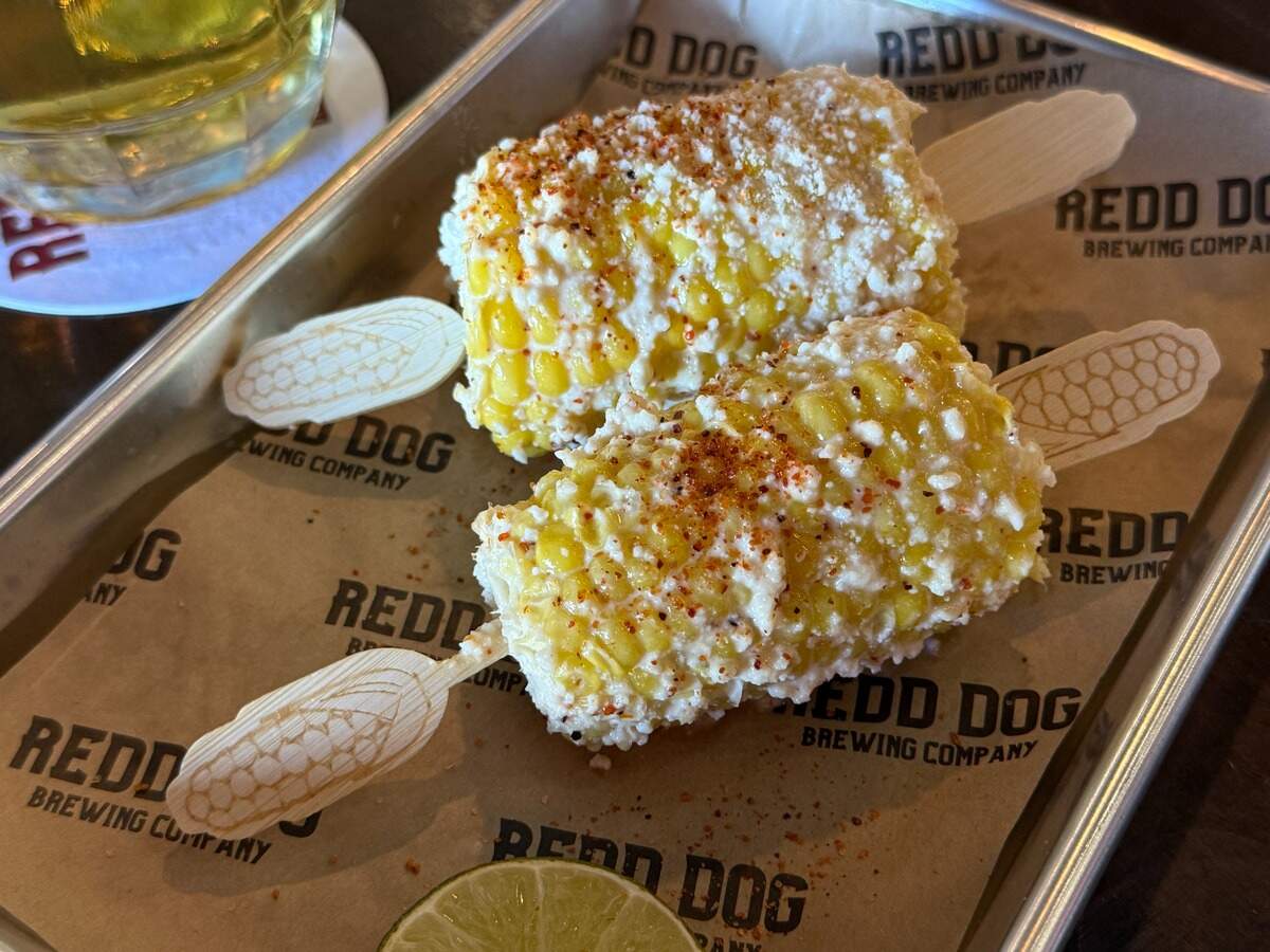 Street corn is conveniently cut in half to share. Other dishes, like guac and esquites, can be ordered in small or large sizes to share.