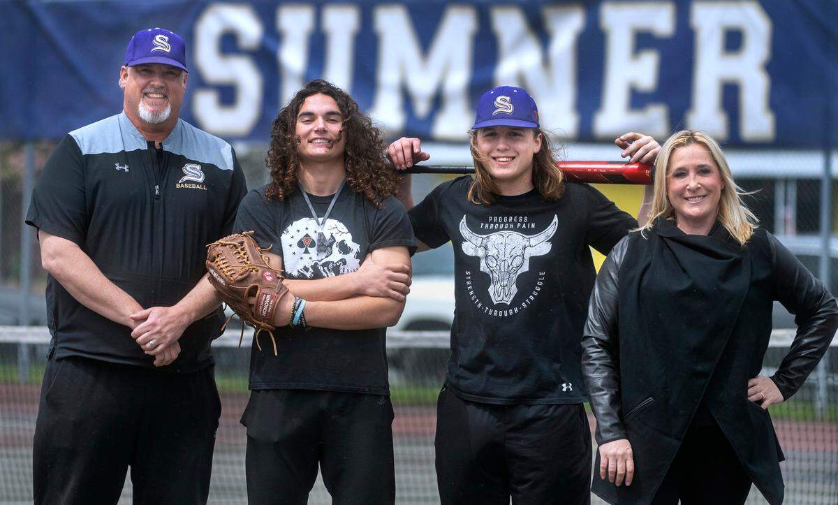 Sumner assitant baseball coach Justine Mentink with his son, junior outfielder Jay Mentink, and sophomore catcher/first baseman Jaxen Mentink with his mother, Mariners Live co-anchor Angie Mentink. They are shown at Sumner High School on Wednesday, May 18, 2022.