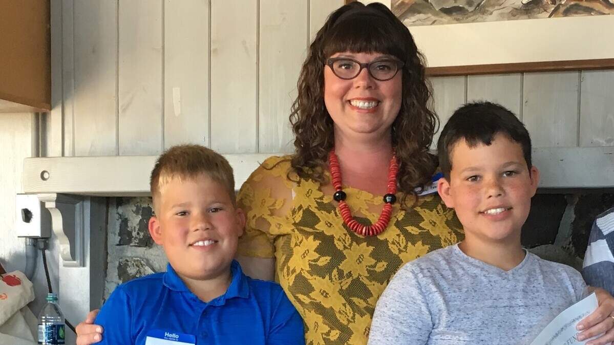 Sara Gray and her two sons, Charlie, 8, left, and Evan, 10
