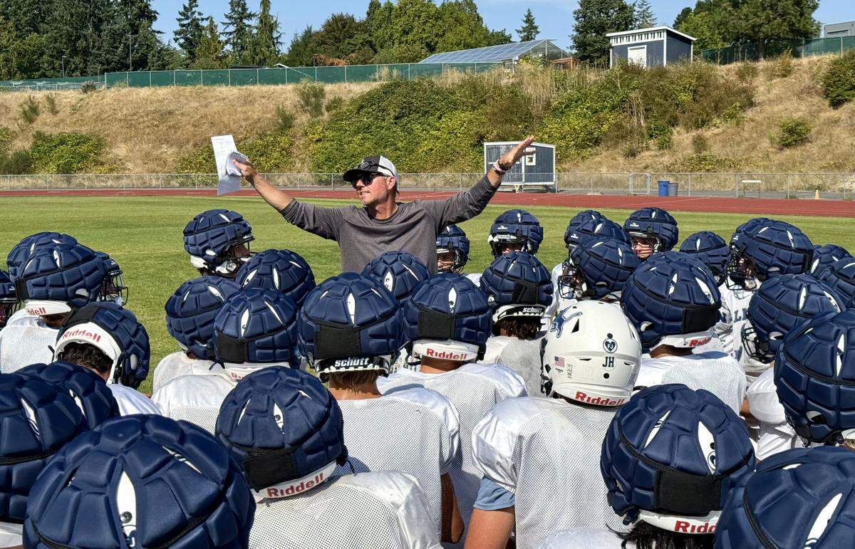 Bellarmine Prep football coach Brian Jensen talks to the team during practice in August, 2025 at Bellarmine Prep in Tacoma, Wash.