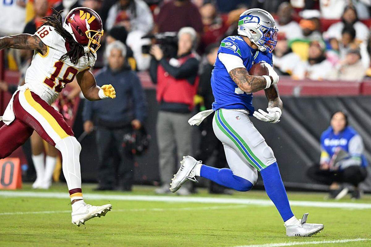 LANDOVER, MARYLAND - NOVEMBER 02: Elijah Arroyo #18 of the Seattle Seahawks catches a pass for a touchdown against Tyler Owens #18 of the Washington Commanders during the second quarter in the game at Northwest Stadium on November 02, 2025 in Landover, Maryland. (Photo by Greg Fiume/Getty Images)