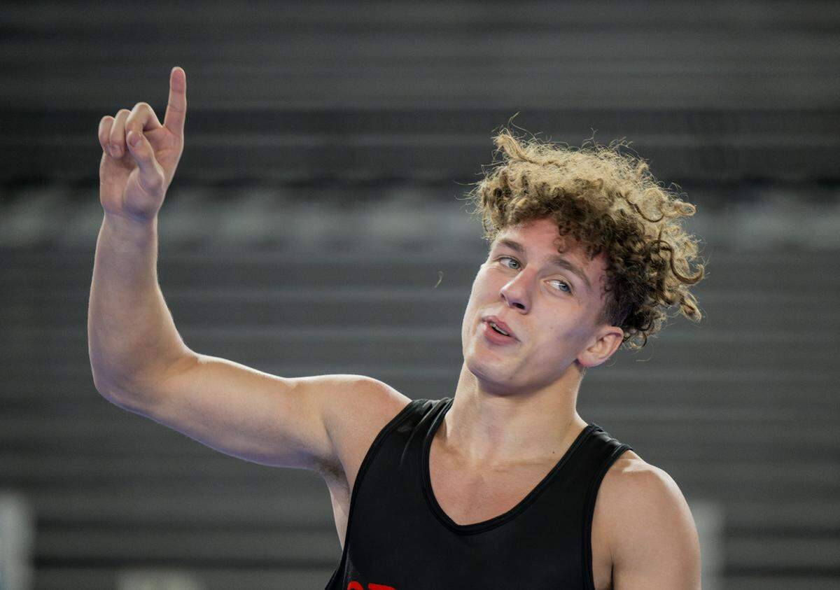 Orting’s Bryan Dickerson reacts to his decision victory over Clarkston’s Dawson Bailey in the 132-pounder 2A semifinal match during day two of the Mat Classic XXXV at the Tacoma Dome on Saturday, Feb. 17, 2024, in Tacoma, Washington.