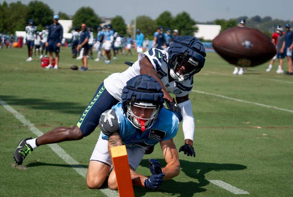 Seattle Seahawks cornerback Michael Jackson (30) guards Tennessee Titans wide receiver Mason Kinsey (12) at Ascension Saint Thomas Sports Park in Nashville, Tenn., Thursday, Aug. 15, 2024. This is the second day of the Titans joint practice with the Seattle Seahawks.