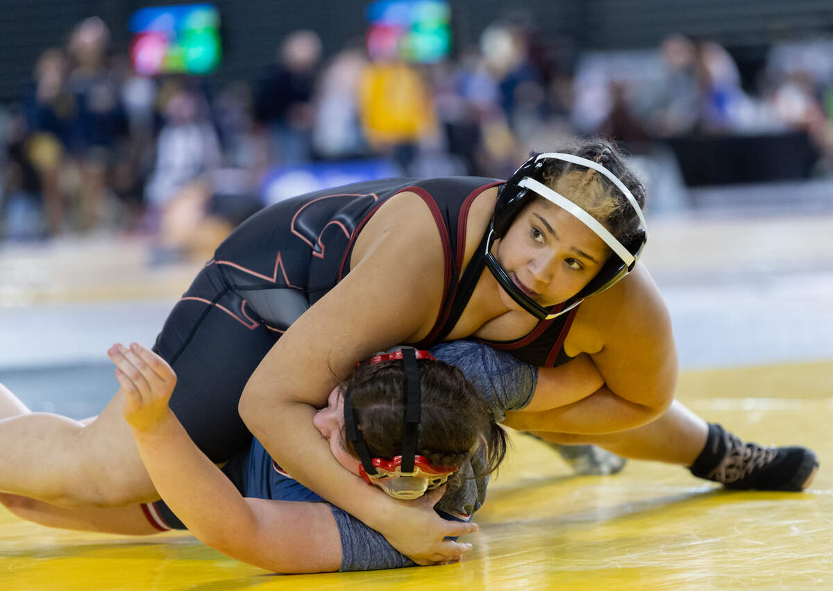 Prairie’s Faith Tarrant looks toward a small grouping of fans as she pins Ellensburg’s Jocelyn Bednarik at Mat Classic XXXIII on Friday, Feb. 18, at the Tacoma Dome. (Joshua Hart/For The Columbian)