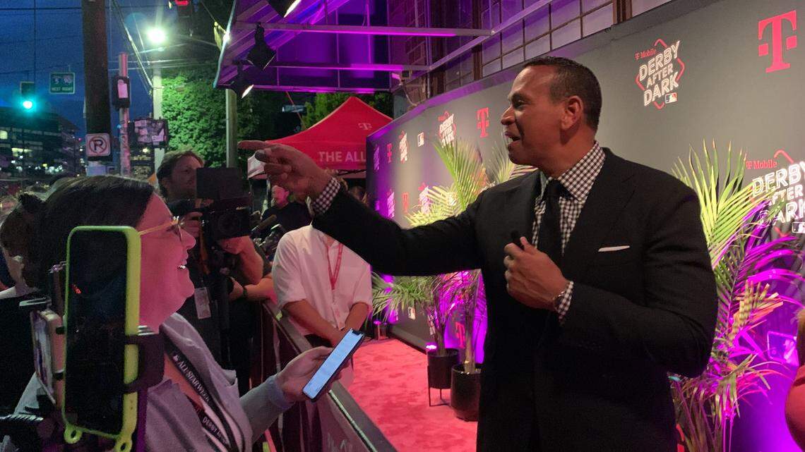 Retired baseball slugger Alex Rodriguez points to a fan passing by along 1st Avenue South in Seattle who had yelled Rodriguez was right for leaving the Mariners in 2000 for the Texas Rangers’ $252 million. Rodriguez, 47, was at the Showbox SoDo for the T-Mobile MLB All-Star Derby After Dark party July 10, 2023.