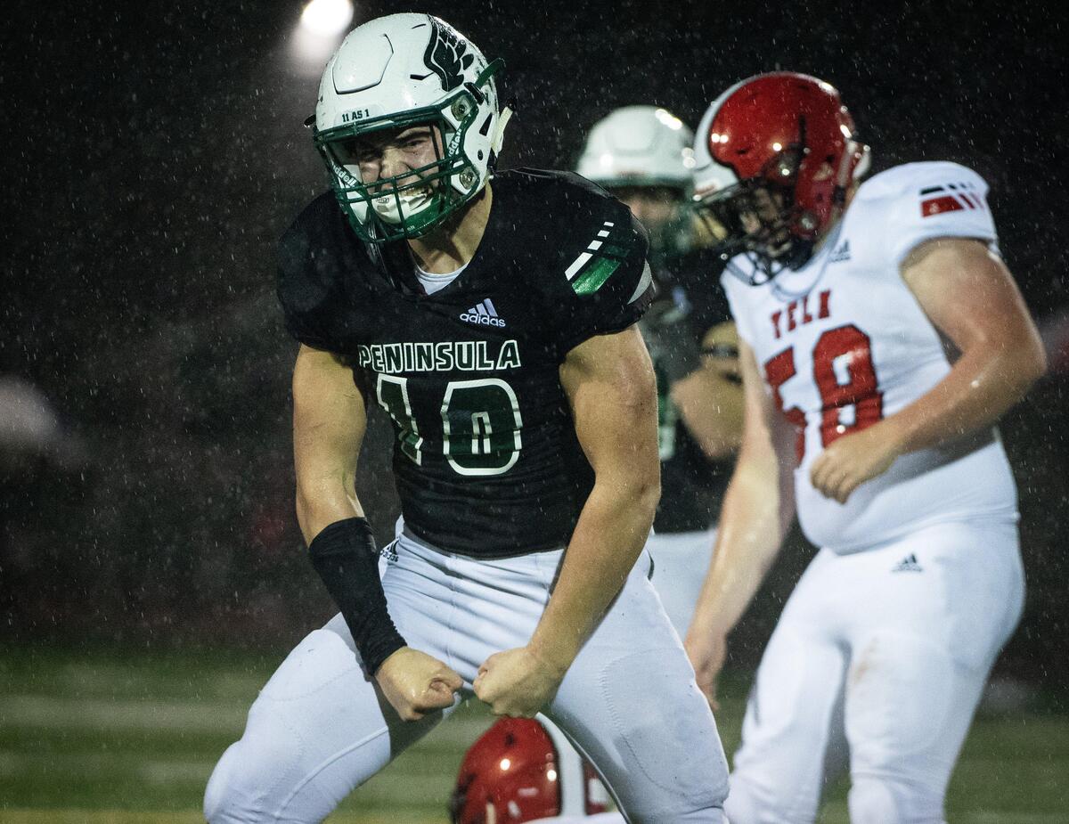 Peninsula’s Sean Skladany reacts after sacking Yelm’s Benjamin Hoffmann during the second quarter. Peninsula played Yelm in a football game at Roy Anderson Field in Purdy, Wash., on Friday, Oct. 18, 2019.