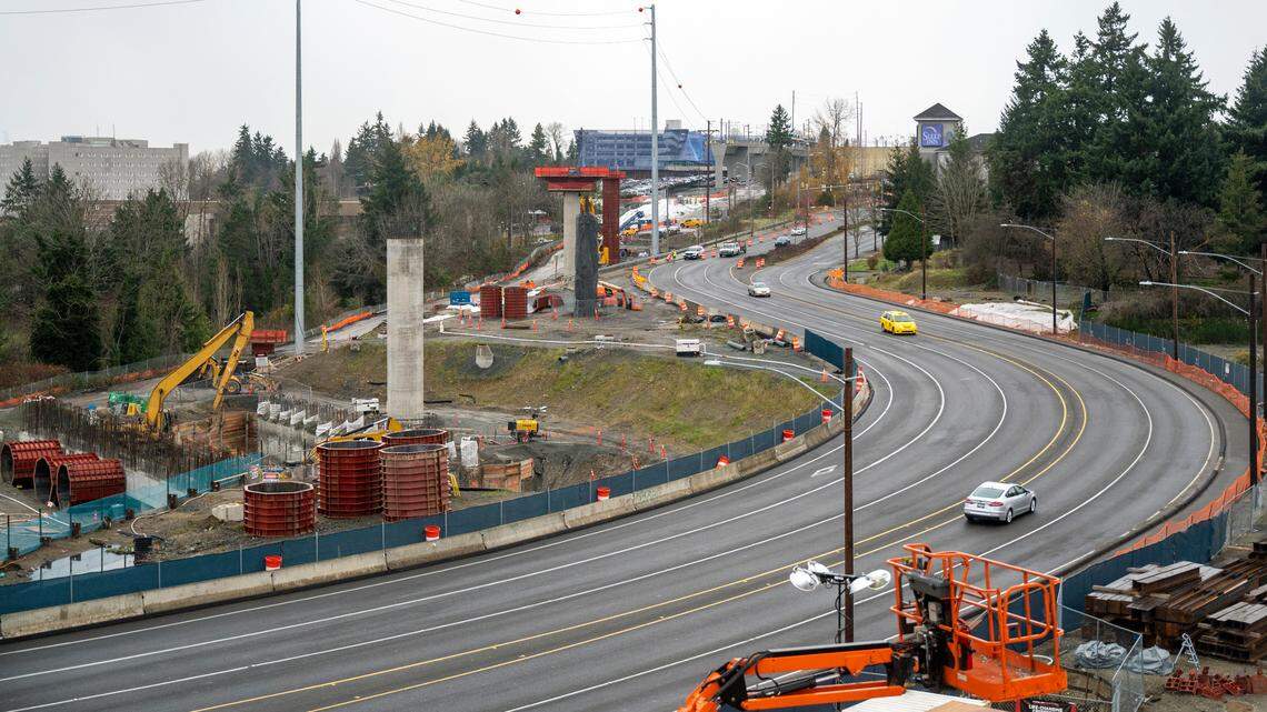 Traffic on Pacific Highway temporarily curves around columns for the new line just south of Angle Lake Station (at top) in SeaTac. The extension adds three stations to the system: Federal Way (at South 320th Street), South 272nd Street (formerly Star Lake Park & Ride) and Kent/Des Moines (near Highline College).